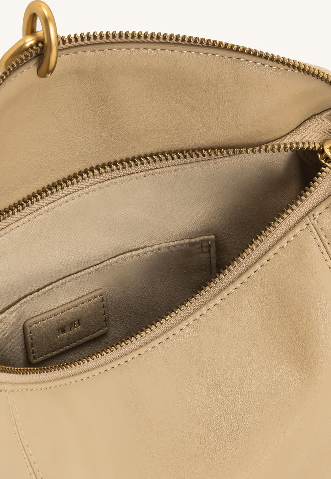 Intérieur du sac bandoulière JW PEI Jayla kaki avec logo de la marque et poche intérieure