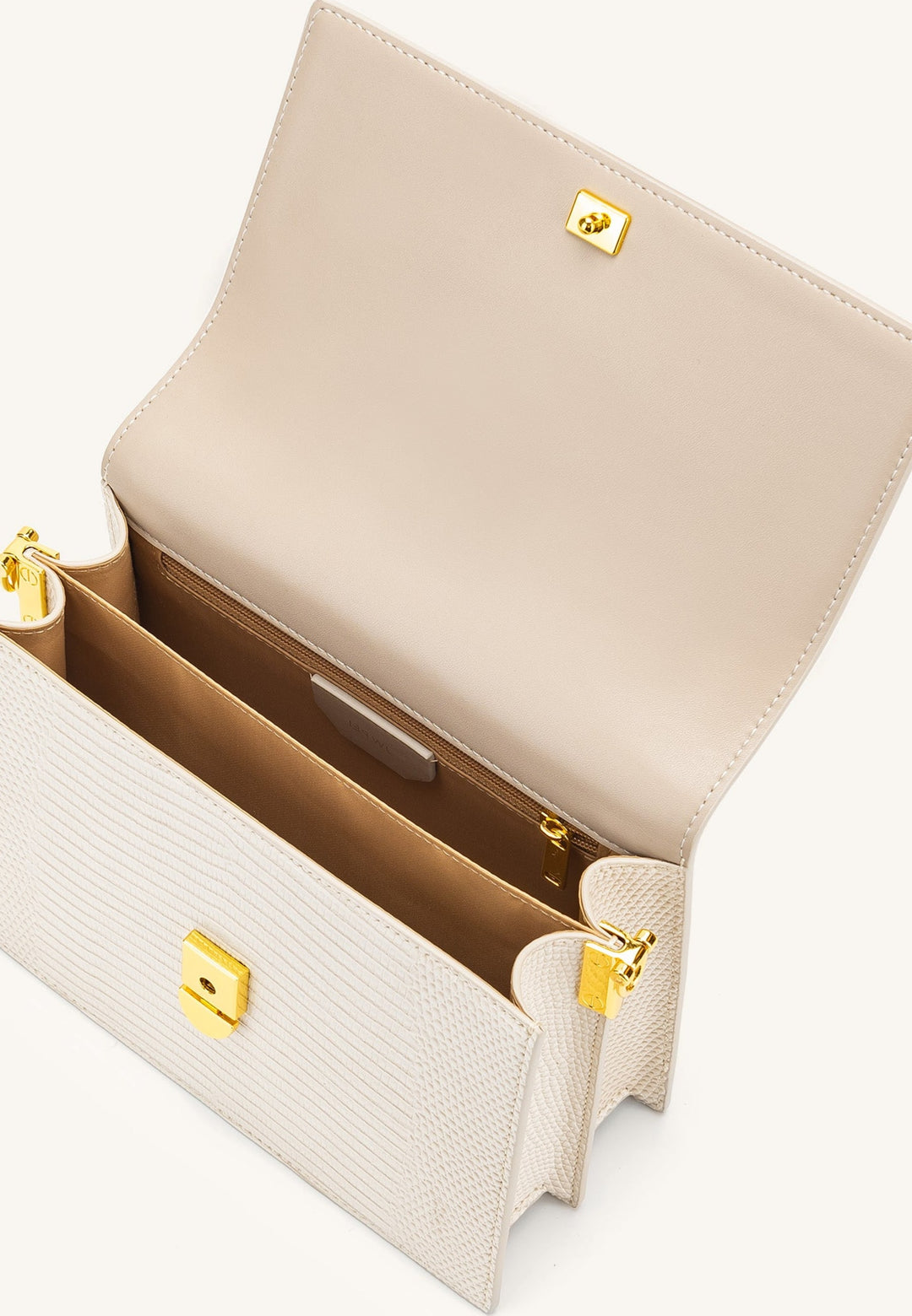 Intérieur du sac bandoulière JW PEI Mini Flap Ivory Lizard, avec doublure en polyester et fermeture éclair dorée.