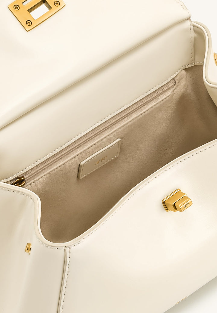 Intérieur d'un sac à main JW PEI Lucia blanc avec fermeture éclair dorée et étiquette de marque