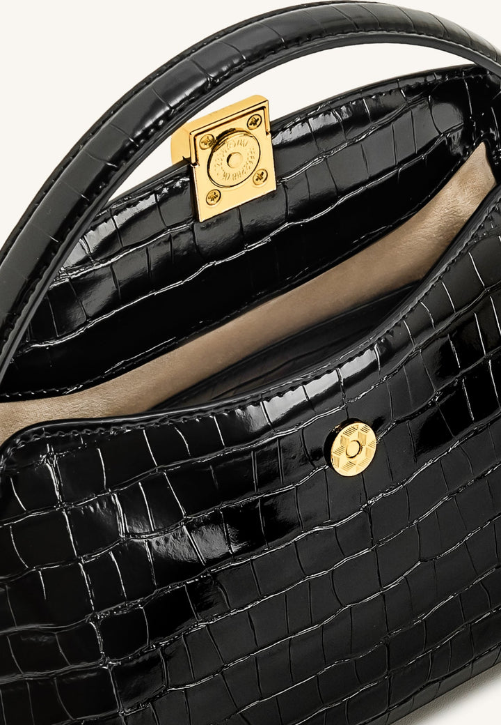 Sac à main JW PEI Talia Black Croc noir, vue intérieure montrant la doublure et la fermeture magnétique dorée.