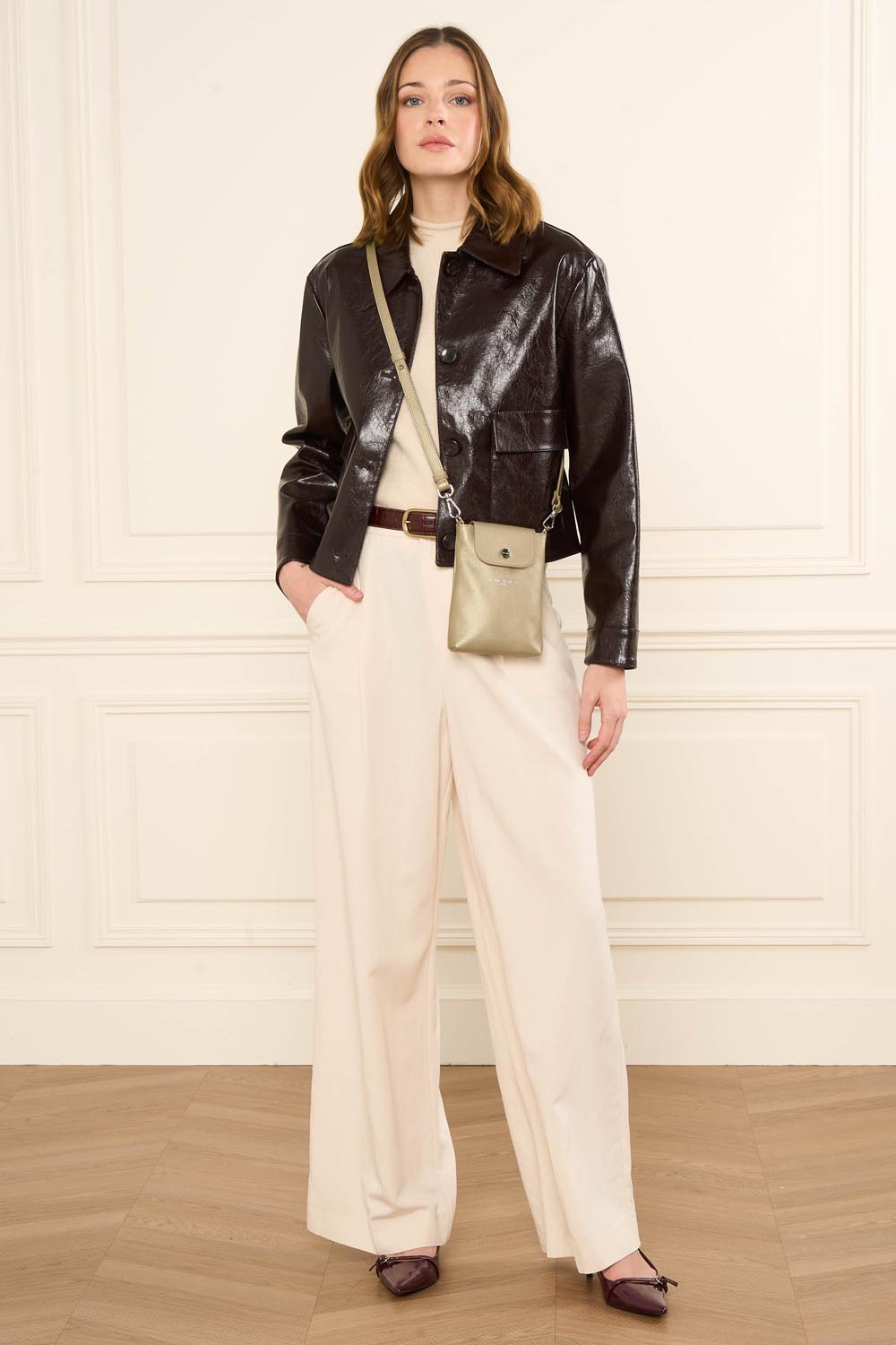 Lancaster Milano Bao Phone Case Dark Blue – Brown jacket and off-white trousers for the Milano Bao clutch worn crossbody.
