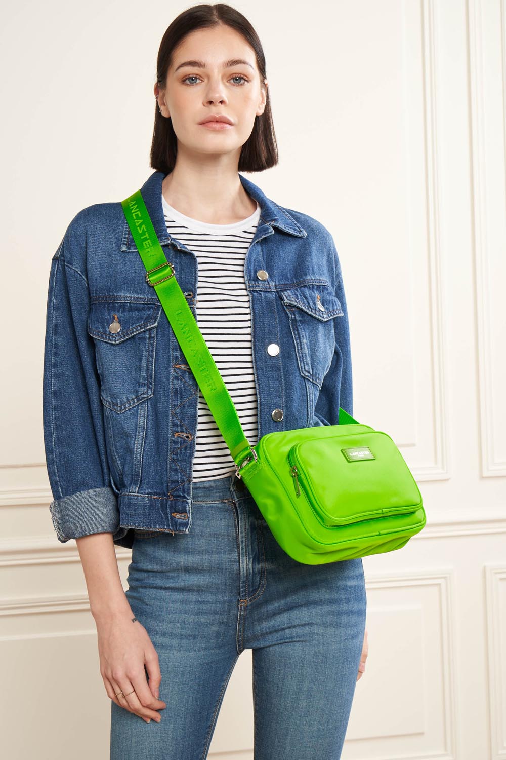 Lancaster Zipped Crossbody Bag Basic Vita Atoll Blue – The Basic Vita Trotteur is worn crossbody with a denim jacket and a striped top.