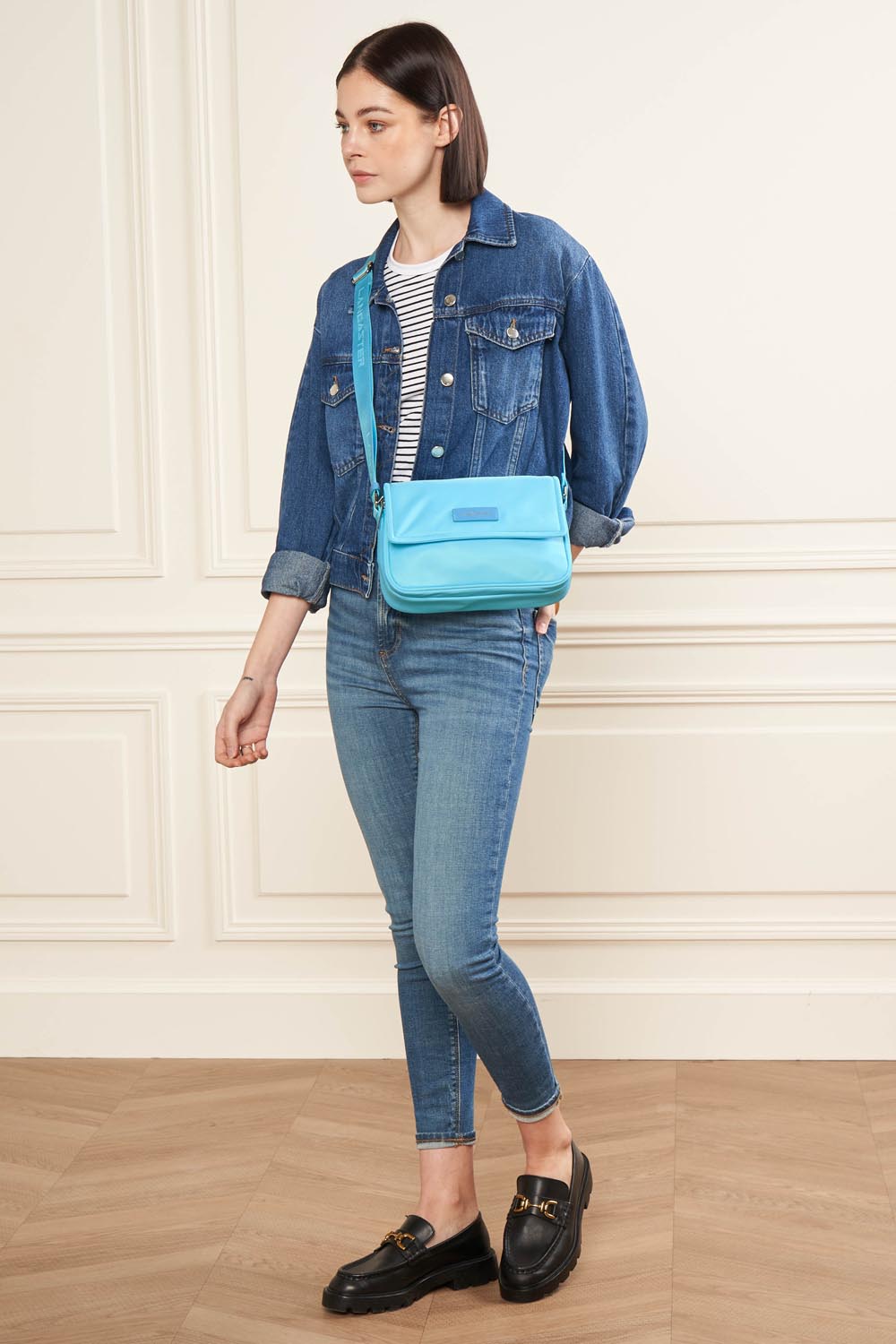Lancaster Basic Vita M Light Green Shoulder Bag – The blue Basic Vita crossbody bag pairs with a denim jacket and matching trousers.